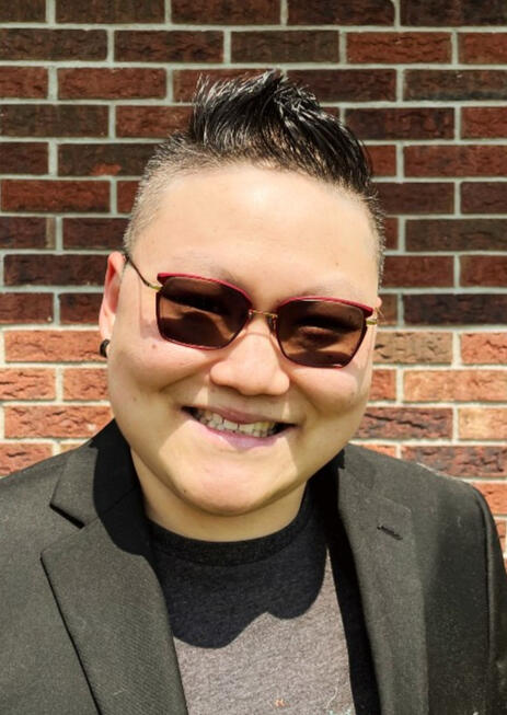 A picture of an Asian person smiling